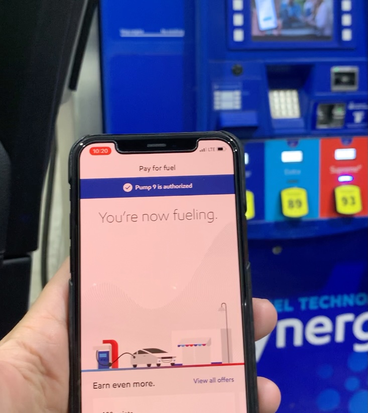 A photo of the Exxon Mobil app in a hand.